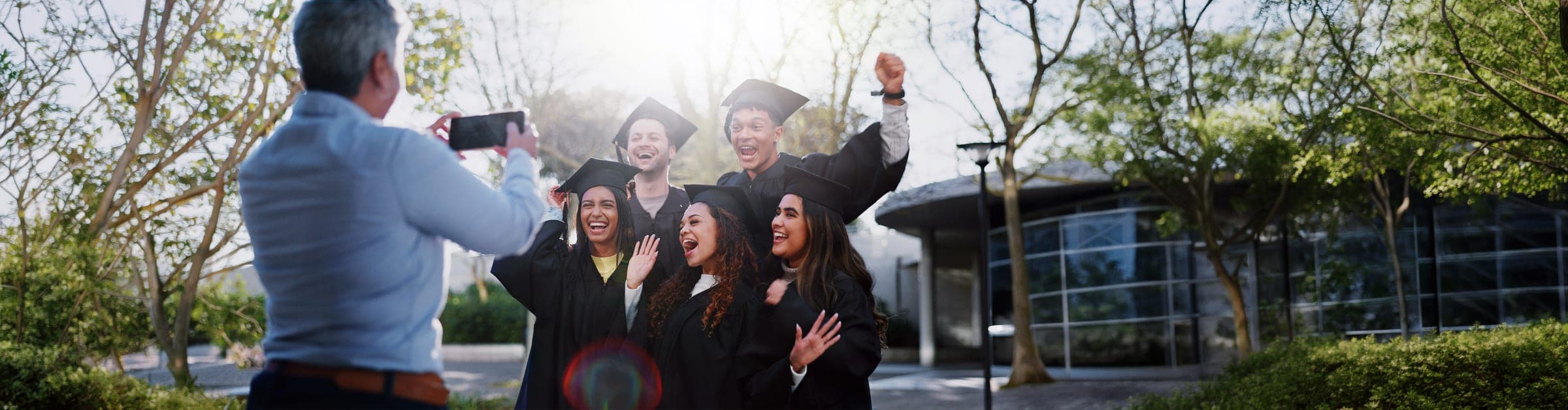 Someone already on campus records graduates with a phone